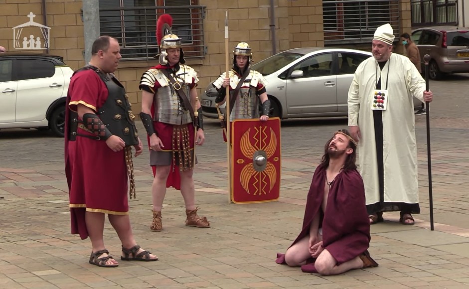 Jesus on his knees in front of roman soldiers