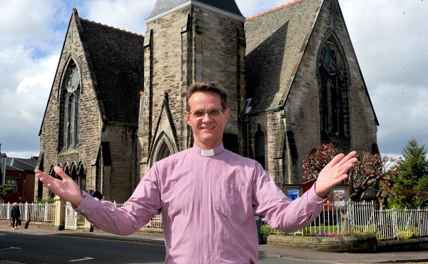 Rev Dr John Carswell of Cadzow Parish Church in front of his church