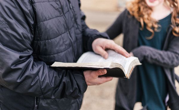 Man and woman discussing bible